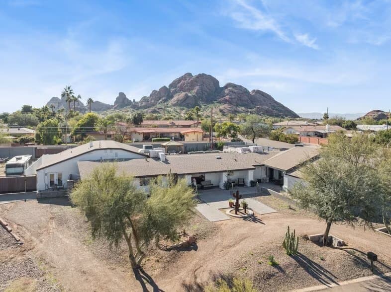 Assisted living home on E Wilshire Dr, Scottsdale, with red-rock buttes behind